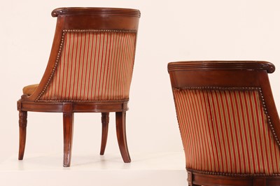 Lot 54 - A pair of Charles X mahogany low chairs