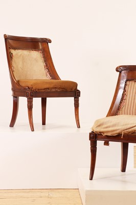 Lot 54 - A pair of Charles X mahogany low chairs