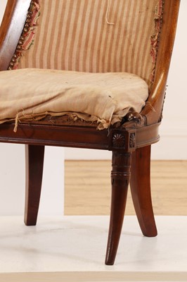 Lot 54 - A pair of Charles X mahogany low chairs