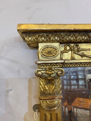 Lot 33 - A George III-style carved giltwood and gesso overmantel mirror