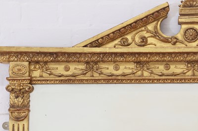 Lot 33 - A George III-style carved giltwood and gesso overmantel mirror