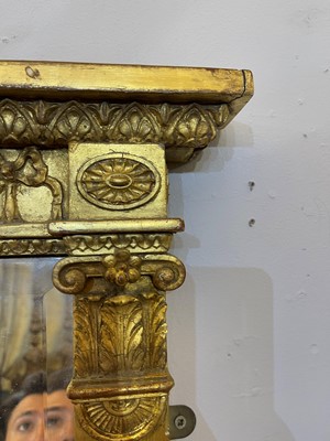 Lot 33 - A George III-style carved giltwood and gesso overmantel mirror
