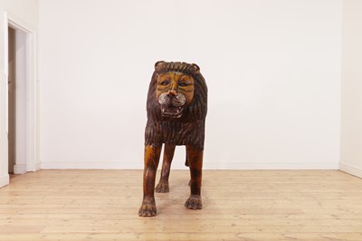 Lot 135 - A large painted pine lion