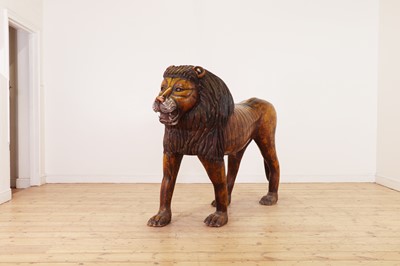 Lot 135 - A large painted pine lion