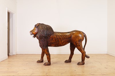 Lot 135 - A large painted pine lion