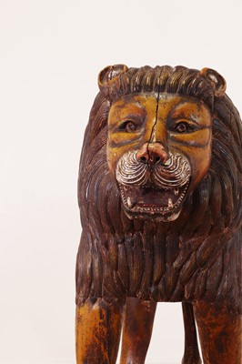 Lot 135 - A large painted pine lion