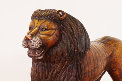 Lot 135 - A large painted pine lion