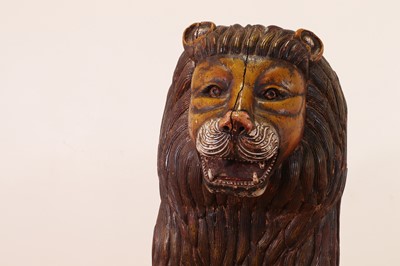 Lot 135 - A large painted pine lion