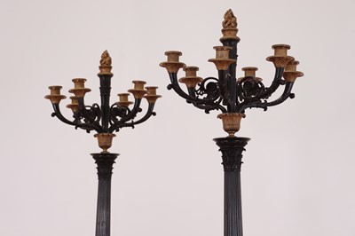 Lot 265 - A pair of large gilt and patinated bronze candelabra