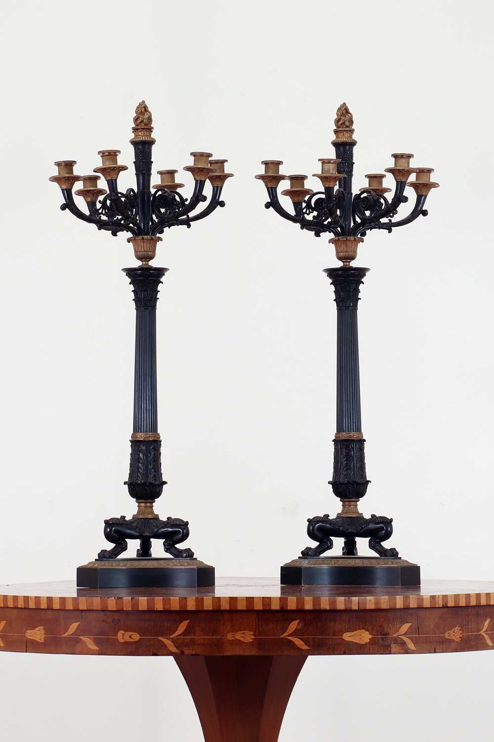 Lot 265 - A pair of large gilt and patinated bronze candelabra