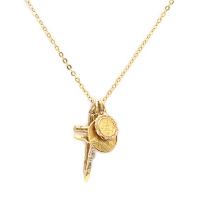 Lot 225 - A collection of gold religious pendants
