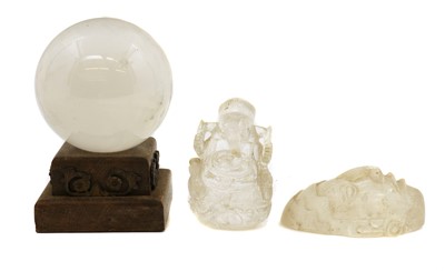 Lot 293 - A crystal glass ball on a stepped wooden stand