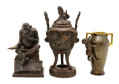 Lot 275 - A modern bronze of a chimp seated on a pile of books