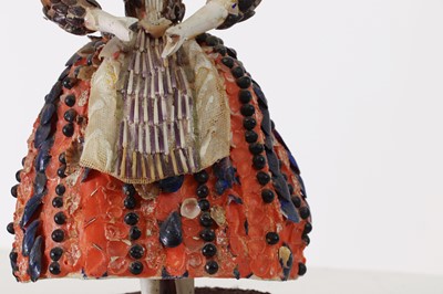 Lot 319 - A pair of papier mâché shell dolls
