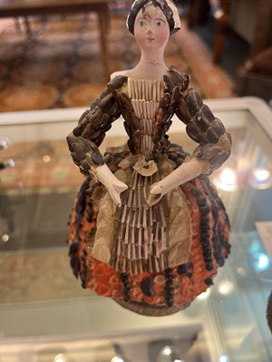 Lot 319 - A pair of papier mâché shell dolls
