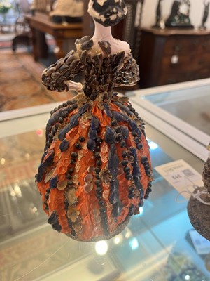 Lot 319 - A pair of papier mâché shell dolls