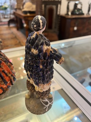 Lot 319 - A pair of papier mâché shell dolls