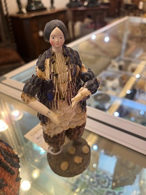 Lot 319 - A pair of papier mâché shell dolls