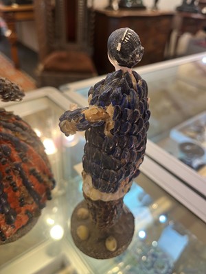 Lot 319 - A pair of papier mâché shell dolls