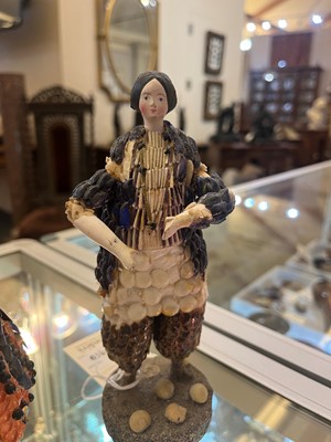 Lot 319 - A pair of papier mâché shell dolls
