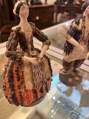 Lot 319 - A pair of papier mâché shell dolls