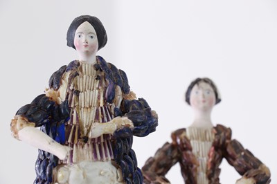 Lot 319 - A pair of papier mâché shell dolls