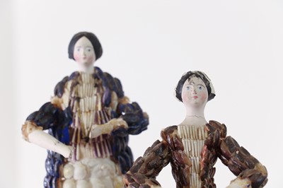 Lot 319 - A pair of papier mâché shell dolls
