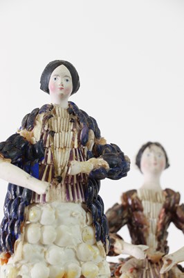 Lot 319 - A pair of papier mâché shell dolls