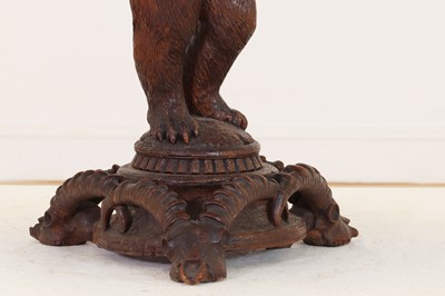 Lot 634 - A Black Forest carved wood occasional table