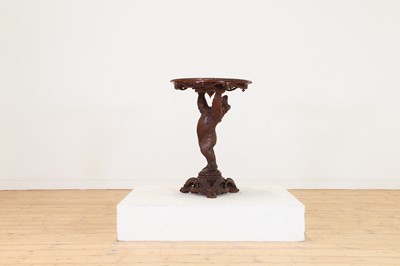 Lot 634 - A Black Forest carved wood occasional table