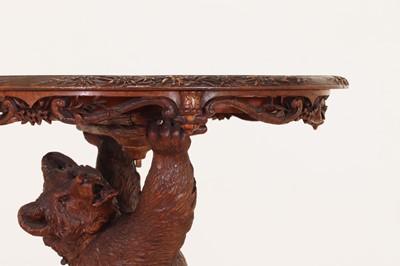 Lot 634 - A Black Forest carved wood occasional table
