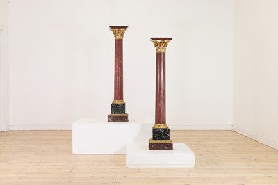 Lot 650 - A pair of rouge marble pedestals