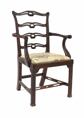 Lot 575 - A carved mahogany elbow chair