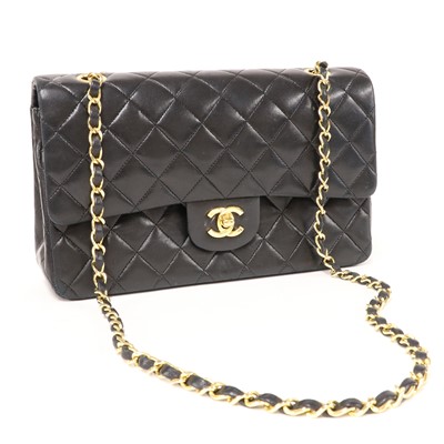 Lot 302 - A Chanel black leather medium flap bag