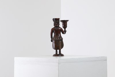 Lot 167 - A bronze figural candlestick