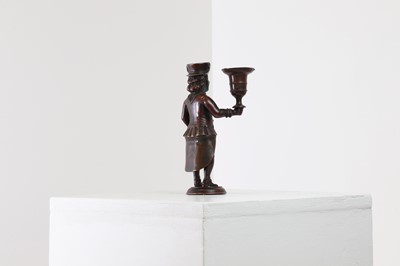 Lot 167 - A bronze figural candlestick
