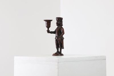 Lot 167 - A bronze figural candlestick
