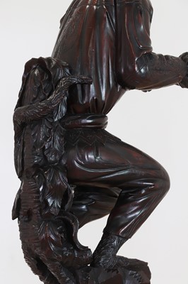 Lot 165 - A pair of large carved walnut monkey waiters