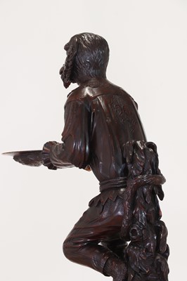 Lot 165 - A pair of large carved walnut monkey waiters