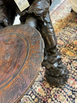 Lot 165 - A pair of large carved walnut monkey waiters