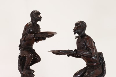Lot 165 - A pair of large carved walnut monkey waiters