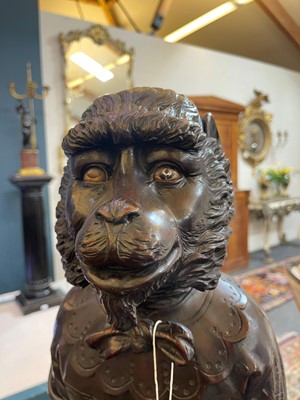 Lot 165 - A pair of large carved walnut monkey waiters