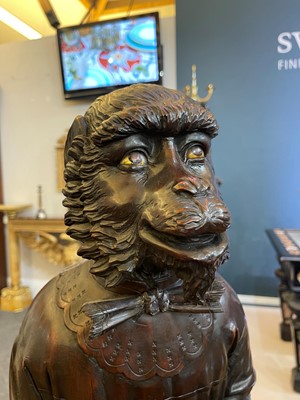 Lot 165 - A pair of large carved walnut monkey waiters