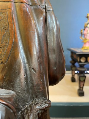 Lot 165 - A pair of large carved walnut monkey waiters