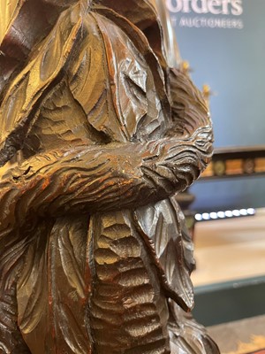 Lot 165 - A pair of large carved walnut monkey waiters