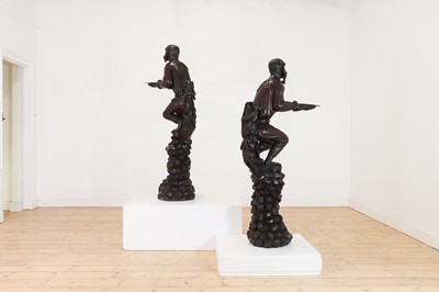 Lot 165 - A pair of large carved walnut monkey waiters