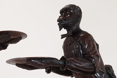 Lot 165 - A pair of large carved walnut monkey waiters