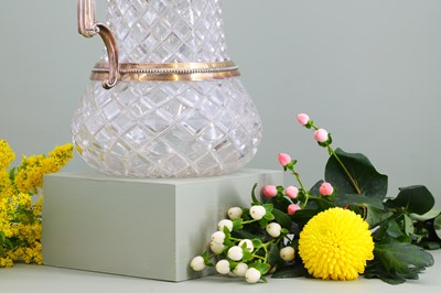 Lot 126 - A silver-mounted cut-glass lemonade or water jug