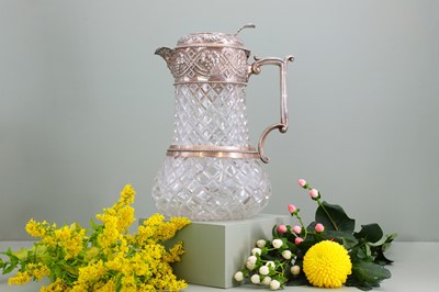 Lot 126 - A silver-mounted cut-glass lemonade or water jug