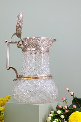 Lot 126 - A silver-mounted cut-glass lemonade or water jug
